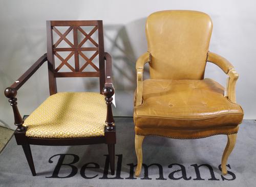 A pair of 19th century ebonised dining chairs with red upholstery, a 20th century mahogany open armchair and a leather upholstered chair, (4).
