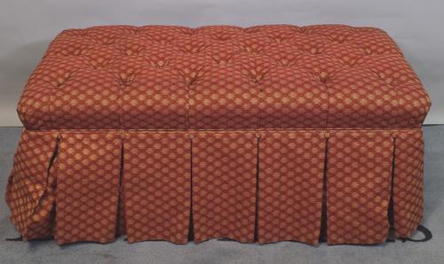 A 20th century rectangular overstuffed footstool with button back upholstery, 111cm wide x 39cm high.