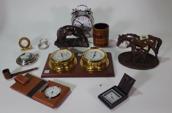 Collectables, including; nine 20th century travel clocks, two faux bronze animal groups, a pipe, a faux book spine pot and a clock/ weather barometer.