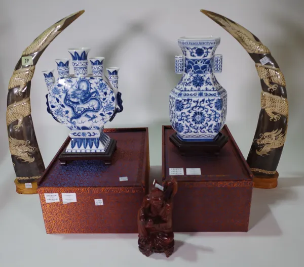 A pair of 20th century carved bovine horns, depicting dragons, a hardwood figure of a sage and two blue and white Chinese vases. S3M