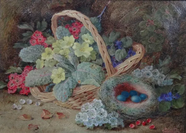 Vincent Clare (British, 1855-1925), Still life of primroses, violets and blossom in a basket with birds nest, oil on canvas signed, 21.5cm x 29.5cm.