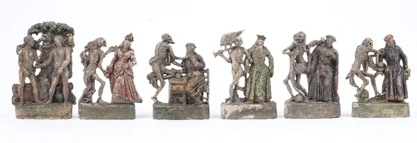 A set of six Zizenhausener terracotta figural groups, early 19th, century depicting scenes from Danse Macabre, each with polychrome painted decoration