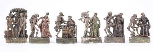 A set of six Zizenhausener terracotta figural groups, early 19th, century depicting scenes from Danse Macabre, each with polychrome painted decoration
