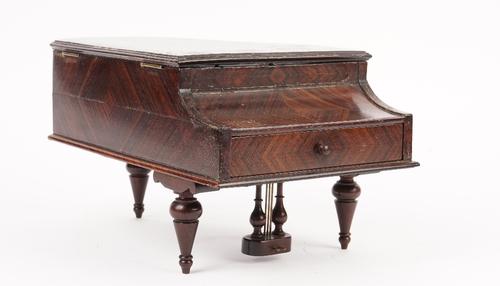 A burr maple and rosewood vanity box, late 19th/early 20th century, in the form of a grand piano, the hinged lid opening to reveal a mirrored undersid