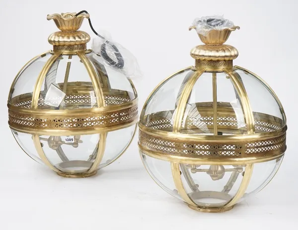 A pair of Georgian style brass lanterns, modern, of globular form with pierced circlet and internal four light fitment, 50cm diameter, 58cm high, susp