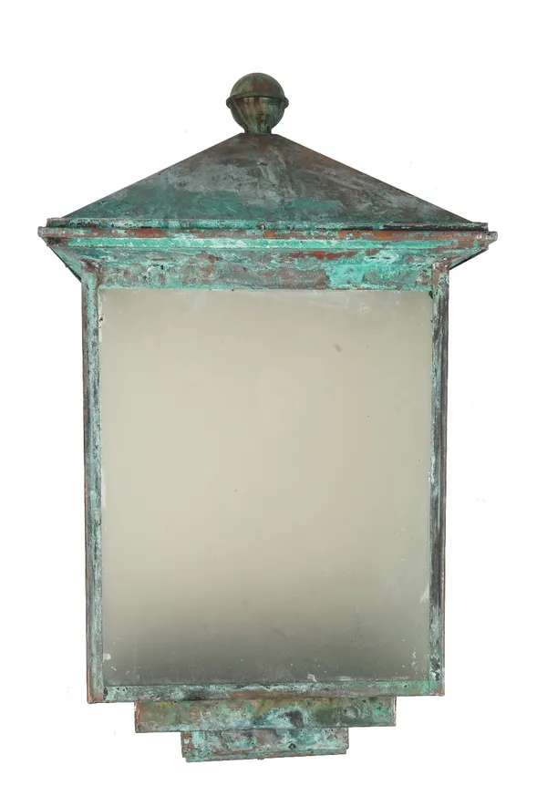 A large copper gate lantern of square stepped form, verdigris patination with later panels on a wrought iron wall mounting frame, 86cm high.