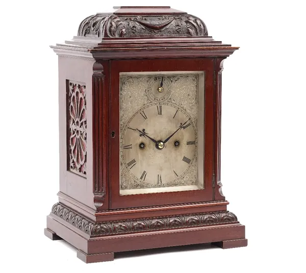 A Victorian mahogany cased mantel clock with silvered dial, subsidiary strike/silent, enclosing a two train movement with hammer striking a coiled gon