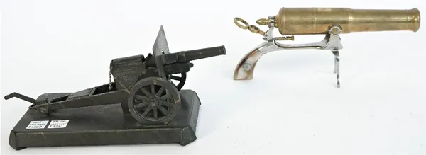 A brass novelty canon model on an iron pistol gripped frame, 20th century, with two piece mother-of-pearl handle, 24.5cm and a Demley table lighter mo