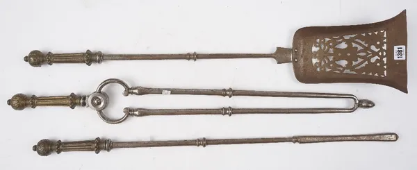 A set of three Georgian steel fire irons, each with fluted brass handles and knopped shafts, shovel, 85cm. (3)