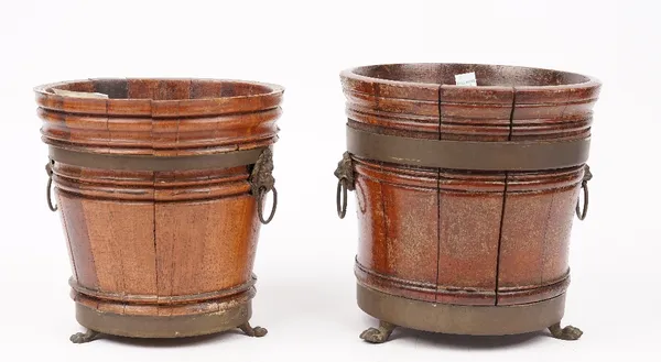 Two oak copper bound Dutch style wine coolers, 19th century, with twin brass iron ring handles and banding on three lion paw feet, the tallest 21.5cm