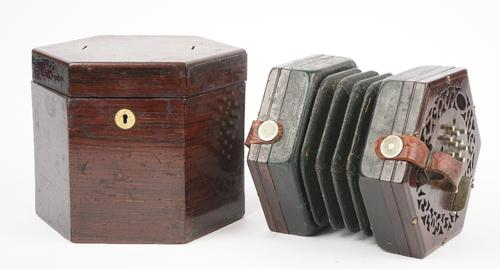 A 19th century rosewood case concertina, probably by Wheatstone and Co, with fretwork decoration and twenty-four metal keys in a rosewood case. (a.f.)