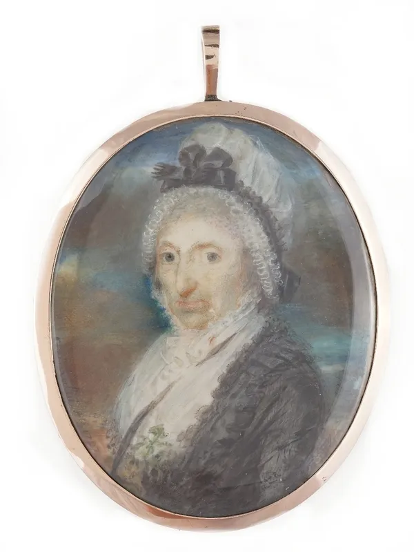 Gold framed Georgian miniature of an old lady in a bonnet, signed bottom left and date 1797, reverse with woven hair and gold initials, 9cm.