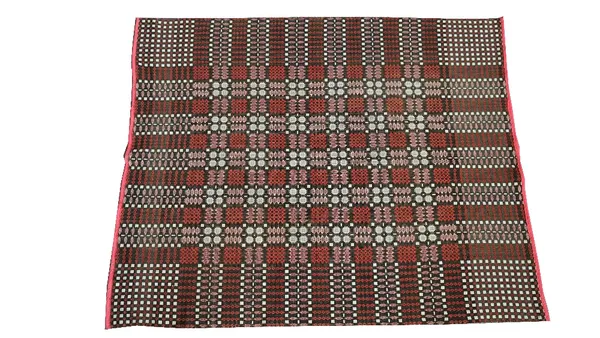 A Welsh woven blanket in brown red and white, central squared design, outer banded design, contrasting pattern on reverse, 186cm x 172cm.