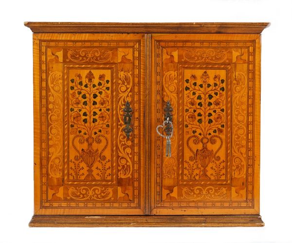 Augsburg early 17th century, an extensively marquetry inlaid table cabinet, the pair of doors enclosing a fitted interior depicting Orpheus taming the