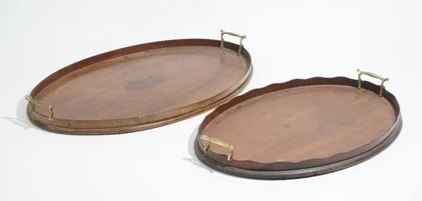 A 19th century inlaid mahogany oval serving tray, with wavy gallery, 63cm wide x 40cm deep, together with another similar, 52cm wide x 35cm deep.