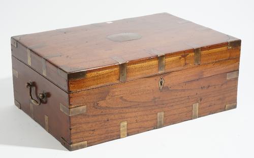 A 19th century Anglo-Indian brass bound teak travelling campaign table box, 57cm wide x 22cm high.