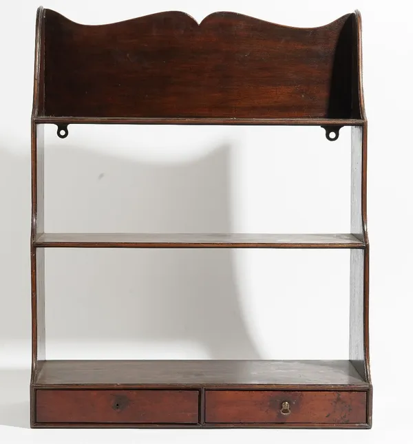 A set of George III mahogany hanging waterfall three tier wall shelves, with a pair of drawers, 53cm wide x 65cm high.