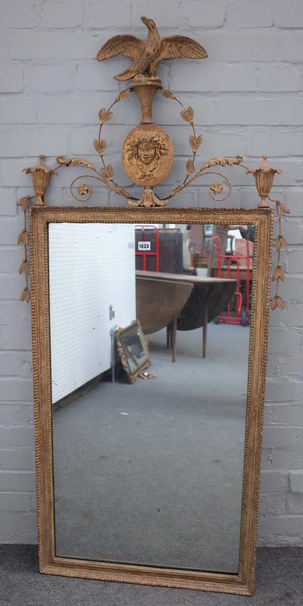 A 19th century French gilt mirror, with eagle and face mask crest over rectangular plate, 72cm wide x 155cm high.