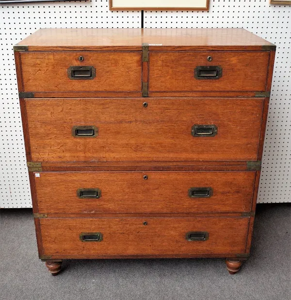 A 19th century brass bound oak campaign chest, with two short and three long graduated drawers on screw-off turned feet, 99cm wide x 112cm high.