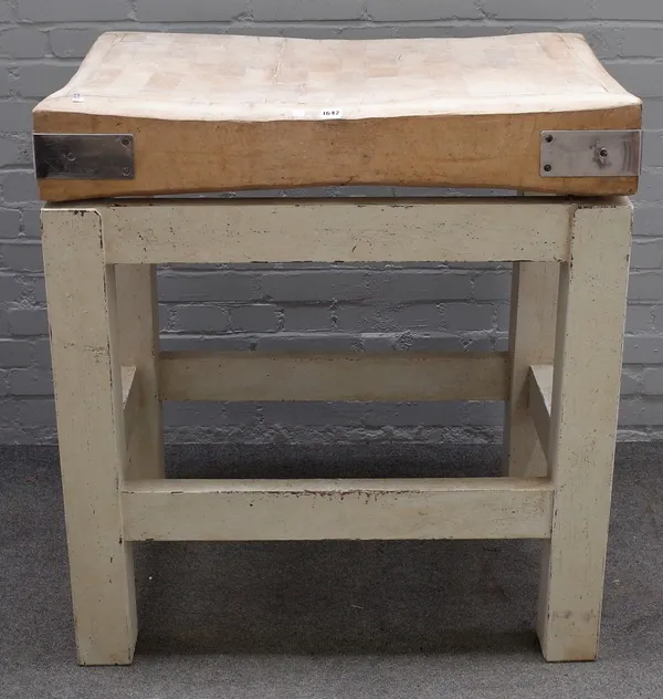 A rectangular beech butchers block, on painted square supports, 93cm wide x 100cm high.