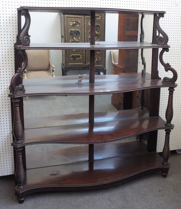 A 19th century Anglo-Portuguese mahogany mirror back display shelf, on five serpentine tiers, on spiral fluted baluster columns and serpent supports,