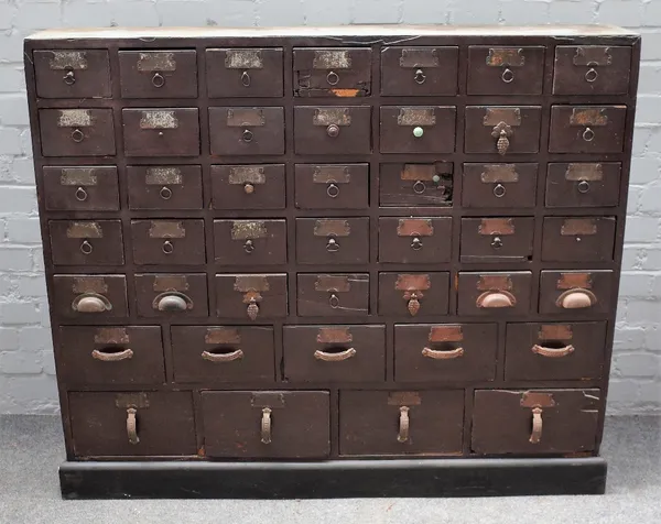 A metal bound hardwood forty-four drawer apothecary chest, on plinth base, 126cm wide x 108cm high.