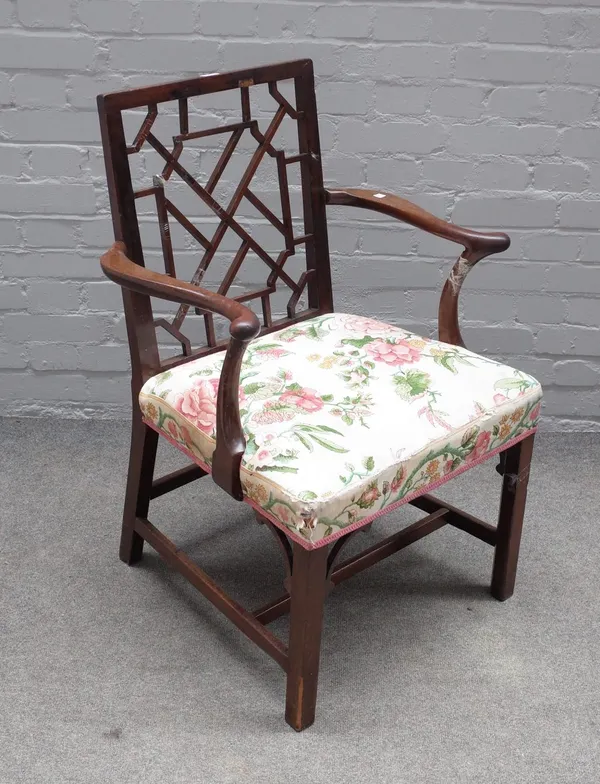 A George III mahogany openarm carver chair, with square cockpen back and block supports, 65cm wide x 91cm high.