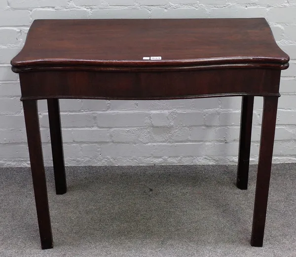 A mid-18th century mahogany serpentine card table, on square supports, 86cm wide x 75cm high.