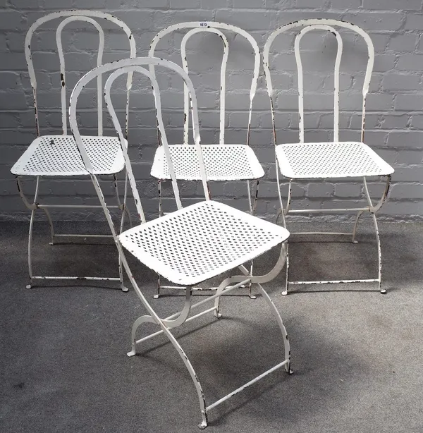 A set of four 20th century white painted wrought iron garden chairs, on 'X' frame bases, 37cm wide x 91cm high.