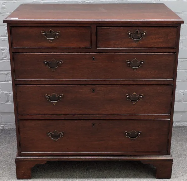 A mid-18th century oak chest, with two short over three long graduated drawers, on bracket feet, 86cm wide x 89cm high.