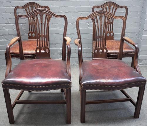 A set of eight George III mahogany splat back dining chairs, on channelled square supports, to include a pair of carvers, (8).