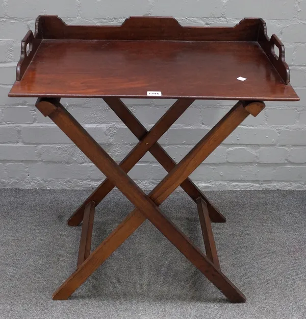 An early 19th century mahogany butler's tray, with three quarter gallery on folding stand, 87cm wide x 73cm high.