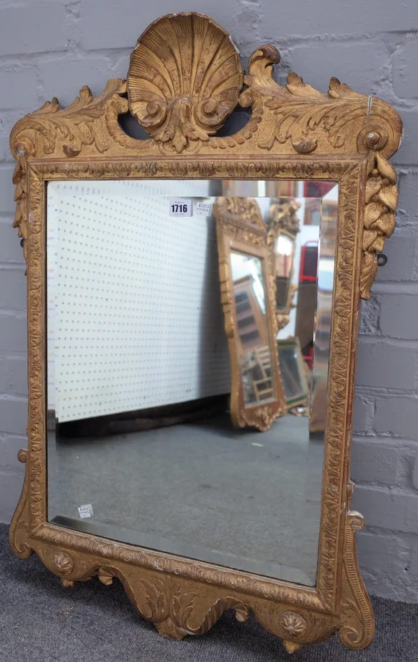 A George II style shell crested gilt wall mirror, 58cm wide x 87cm high, together with a parcel gilt green painted mirror, 40cm wide x 90cm high. (a.f