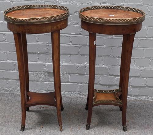 A pair of Louis XVI style provincial yewwood table ambulante, 19th century, the oval tops with pierced brass galleries, on splayed legs united by a co