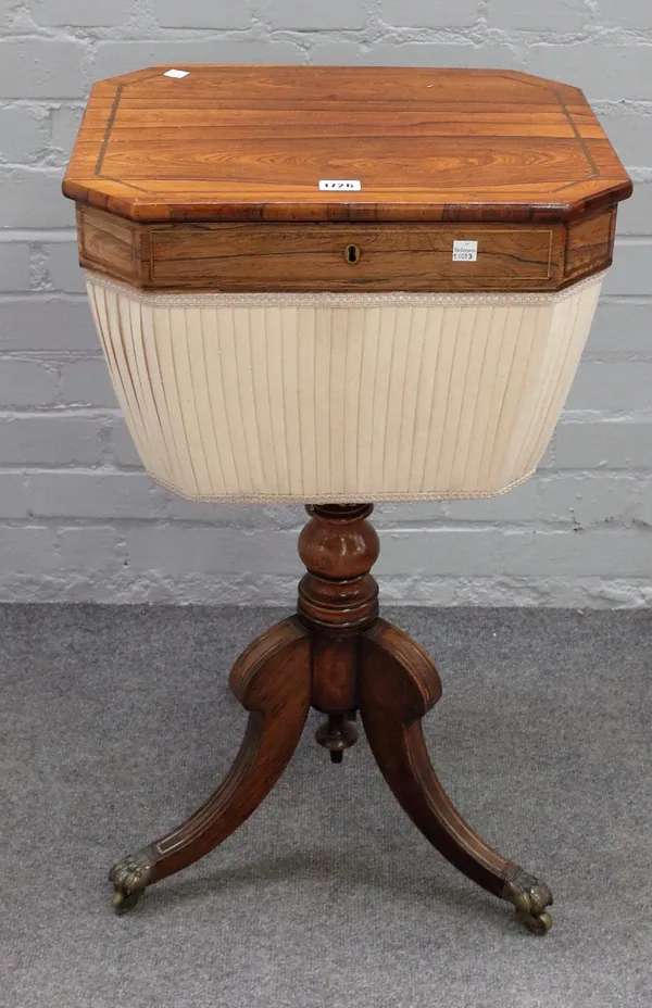 A Regency brass inlaid rosewood lift top work table, on three downswept supports, 45cm wide x 78cm high.