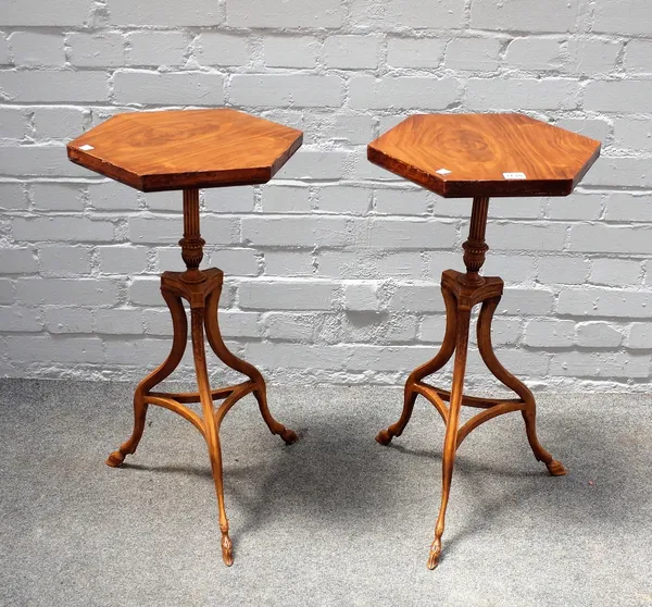 A pair of 18th century style walnut hexagonal topped occasional tables, on three hoof feet, 40cm wide x 73cm high.