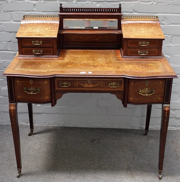 An Edwardian inlaid bonheur de jour, with fitted mirror back over three frieze drawers on tapering square supports, 102cm wide x 104cm high.