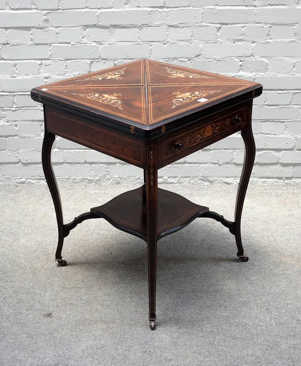 An Edwardian marquetry inlaid rosewood envelope card table, on cabriole supports, 58cm wide x 75cm high.