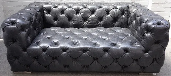 A black button leather upholstered two seat sofa, on chrome supports, 165cm wide x 65cm high.