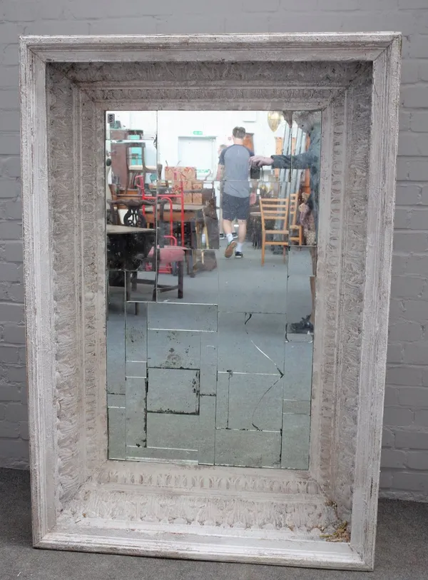 A modern distressed white painted rectangular wall mirror, with deep acanthus and egg and dart moulded frame, 153cm long x 104cm high.