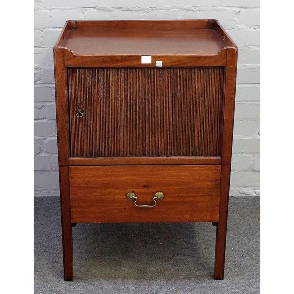 A George III mahogany tray top night stand, with tambour panel over pull-out on block supports, 56cm wide x 82cm high.