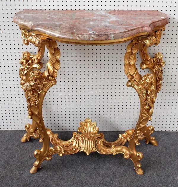 An 18th century style French console table, the shaped marble top on four floral moulded 'C' scroll supports, 19th century, 83cm wide x 89cm high.