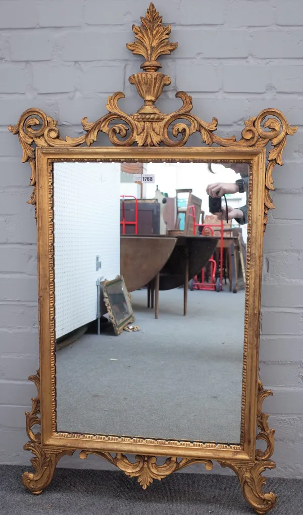 A George III style gilt framed mirror, with acanthus sprays about the rectangular plate, 70cm wide x 122cm high.