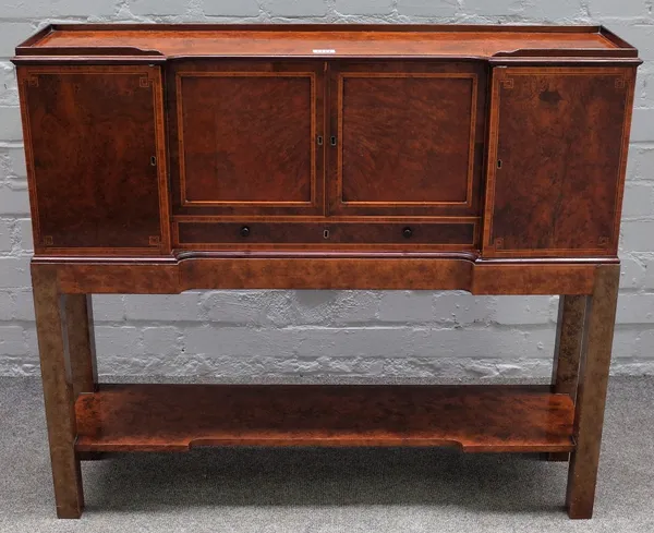 A late 19th century burr yew top to a lady's bonheur du jour, with various drawers and cupboards on later stand, 88cm wide x 78cm high.