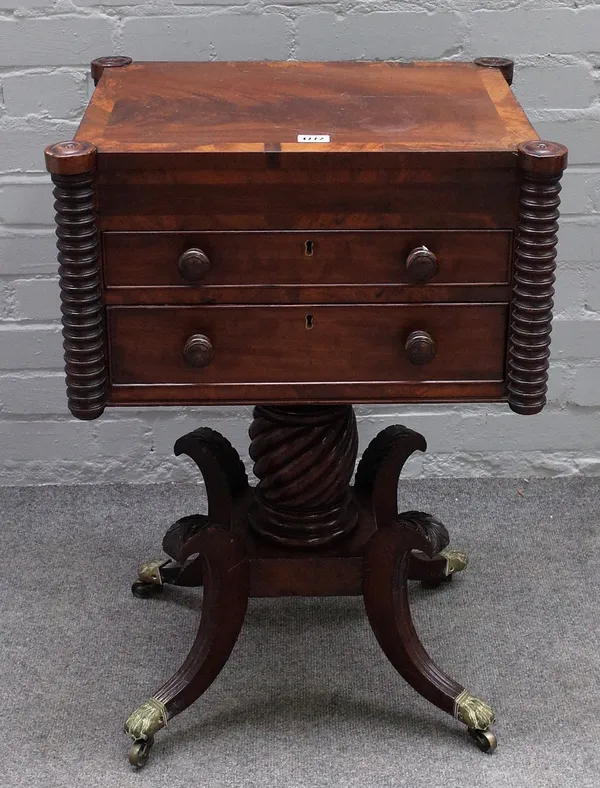 A Regency mahogany and crossbanded writing table, with a fitted right hand side drawer and two drawers below, flanked by outset reel moulded pilasters