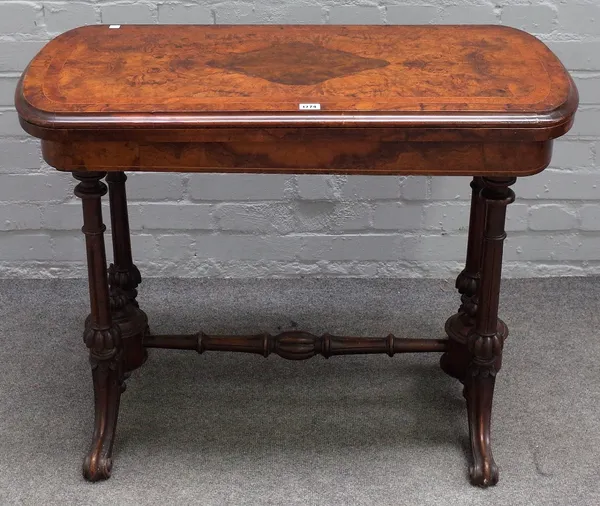 A Victorian figured walnut rounded rectangular card table, on four scroll supports, 92cm wide x 70cm high.