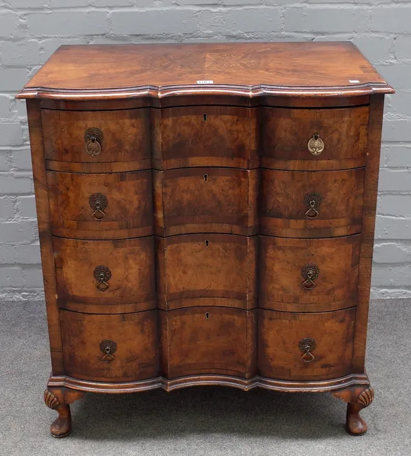 A 17th century Dutch style inlaid walnut chest, of four long shaped drawers on squat cabriole supports, 76cm wide x 85cm high.