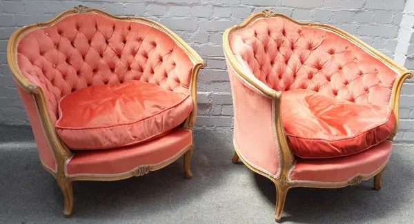 A pair of beech framed tub back armchairs of Louis XV design, on scroll feet, 86cm wide x 82cm high.