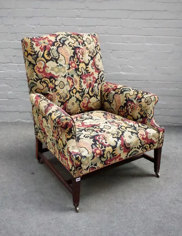 A George III mahogany framed tapestry upholstered easy armchair, on tapering square supports, 91cm wide x 105cm high.