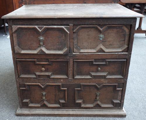 A small Charles II oak chest of four short over one long geometric moulded drawers, 81cm wide x 72cm high.